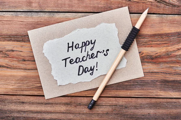 Pencil, happy Teachers Day card.