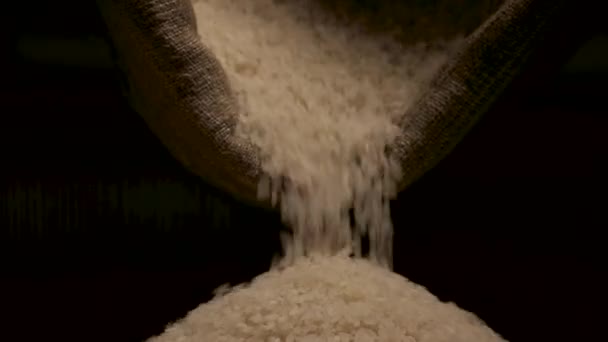 Rice falling from bag. — Stock Video