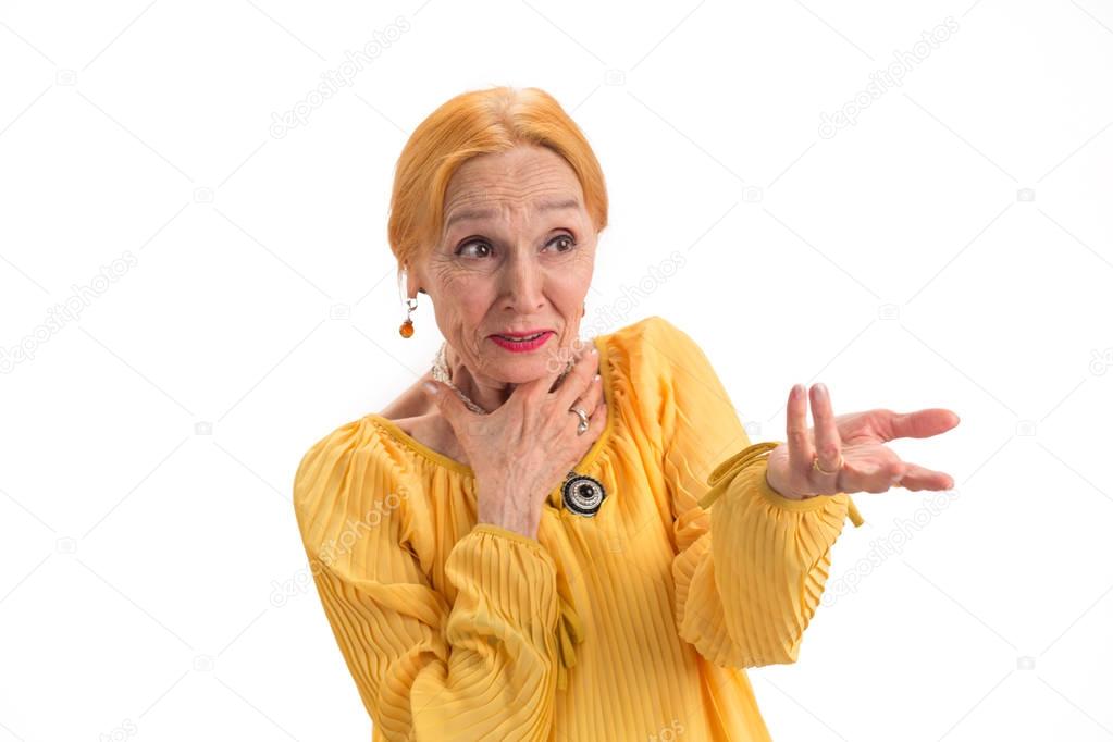 Portrait of surprised old woman.