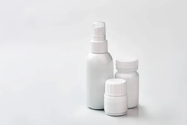 stock image White containers with medicine.