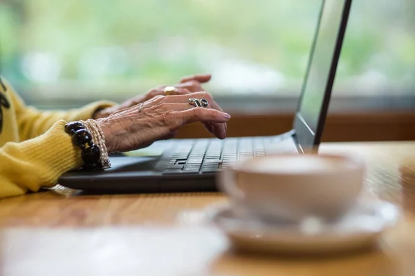 Laptop and old hands.