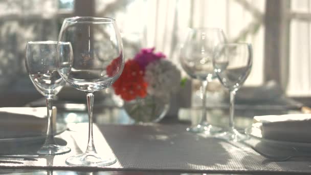 Empty wineglasses on dining table. — Stock Video