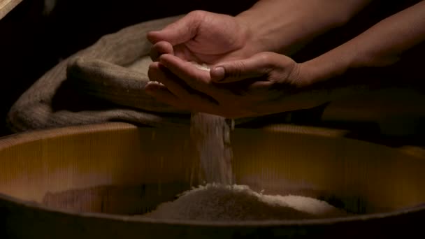 Hands of man and rice. — Stock Video