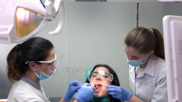 Two dental doctors working. — Stock Video