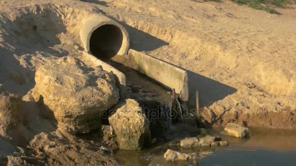 Water flowing from sewage pipe. — Stock Video