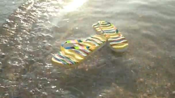 Flip flops floating on waves. — Stock Video