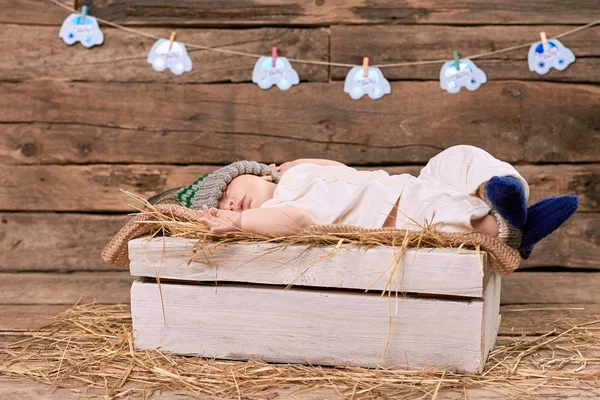 Baby sleeping on straw. — Stock Photo, Image