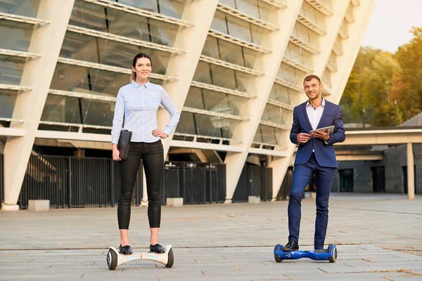 Business people on hoverboards. — Stock Photo, Image