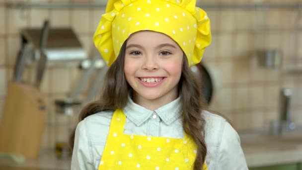 Smiling girl in chef uniform. — Stock Video