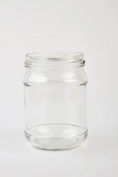 Opened glass jar, white background. — Stock Photo, Image