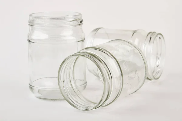 Three glass jar, two lying. — Stock Photo, Image