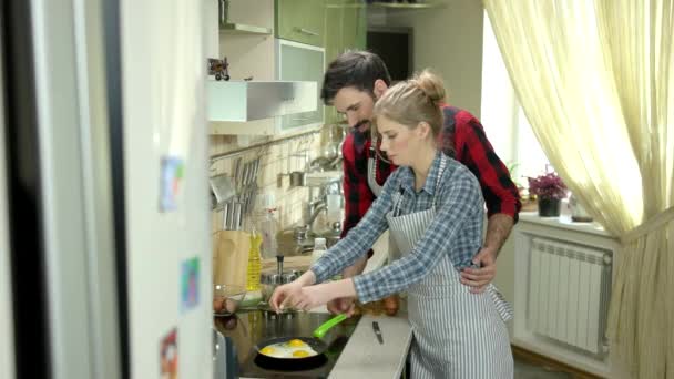 Cheerful man and woman cooking. — Stock Video