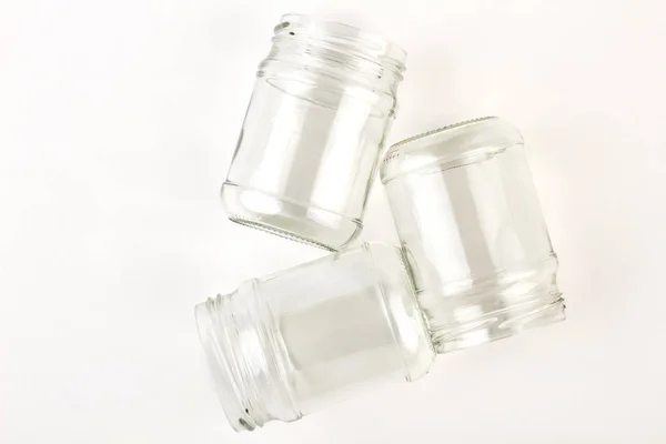 Several transparent glass jars opened. — Stock Photo, Image