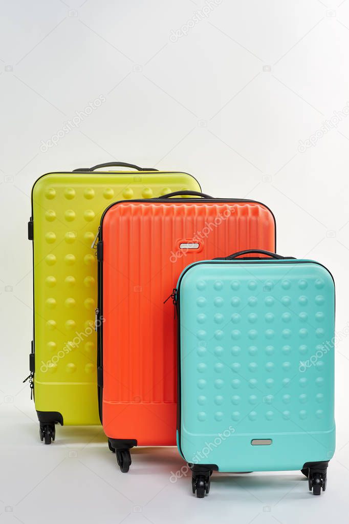 Set of different summer suitcases.