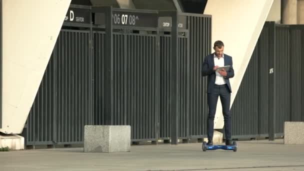 Businessman on hoverboard. — Stock Video