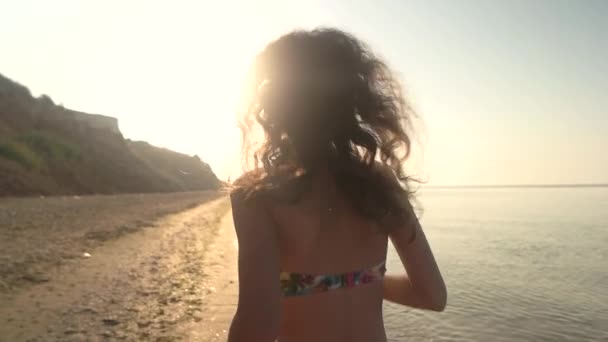 Lady running on beach, slow-mo. — Stock Video