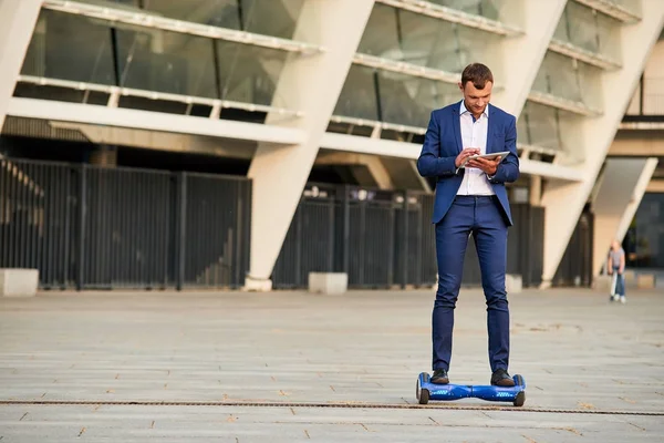 Businessman on hoverboard. — Stock Photo, Image