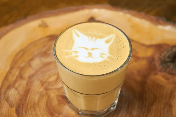 Latte glass with cat art.