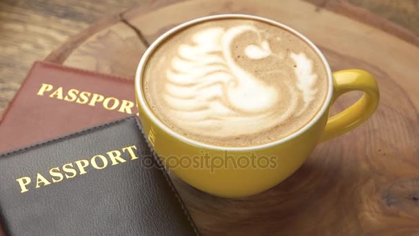 Кофейная чашка и паспорта . — стоковое видео