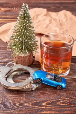 Car, handcuffs, glass of whiskey. clipart