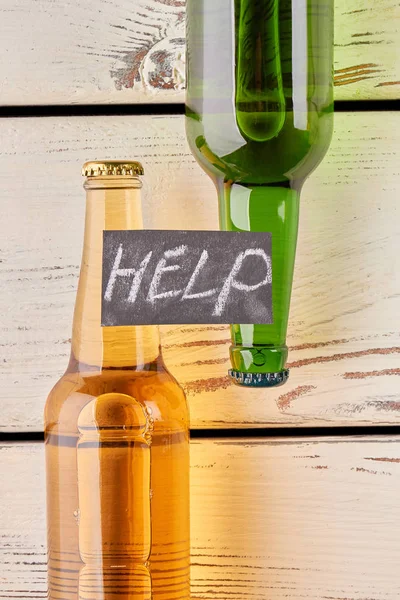 Ayuda con el texto, dos botellas llenas . — Foto de Stock