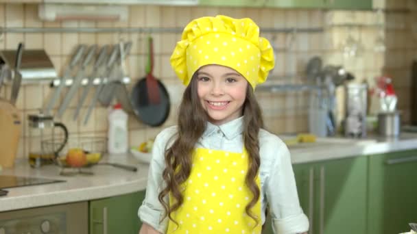 Girl in chef uniform smiling. — Stock Video