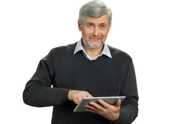 Mature man using computer tablet. — Stock Photo, Image