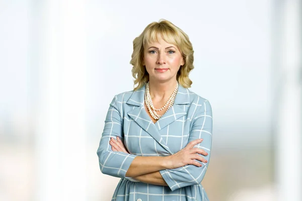Adult woman corporate crossed arms portrait.