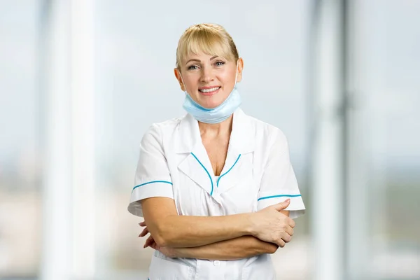 Smiling medical doctor with mask.