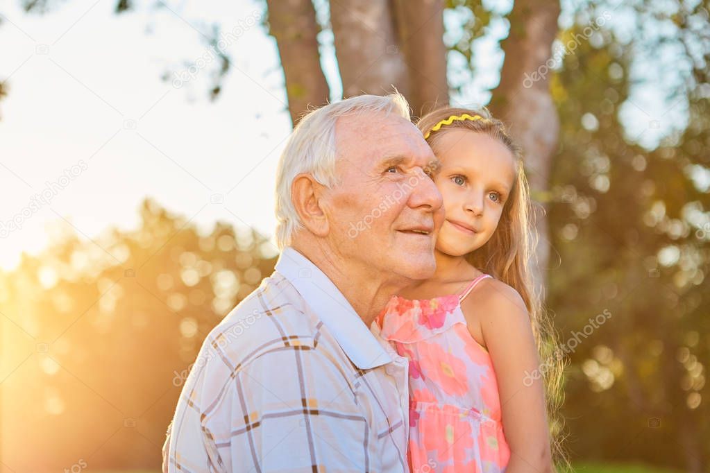 Senior man with his granddaughter.