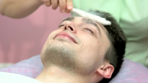 Face cryomassage, caucasian man. — Stock Video