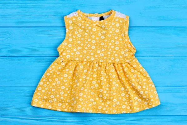 Yellow cotton dress for newborn.