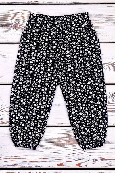 Toddler girl black printed trousers.