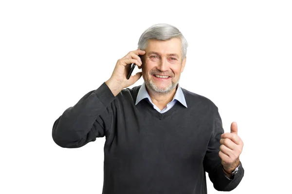 Excited mature man talking on phone. — Stock Photo, Image