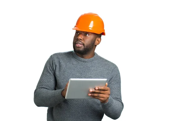 Architect with tablet looking on building. — Stock Photo, Image