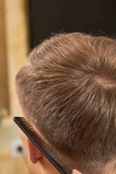 Male hair and comb.