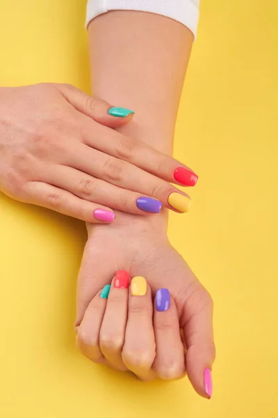 Womans hands with summer colors nails. — Stock Photo, Image