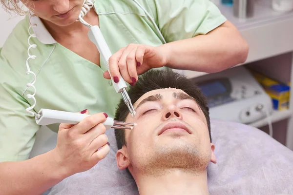 Microcurrent therapy, male face. — Stock Photo, Image