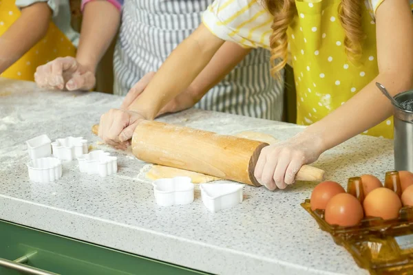 Hands of child rolling dough. — Stock Photo, Image