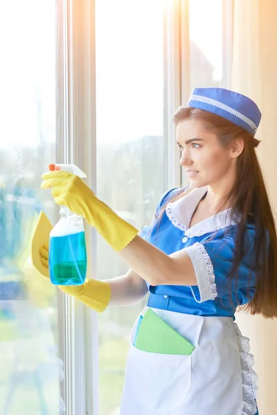 Housemaid is washing window. — Stock Photo, Image