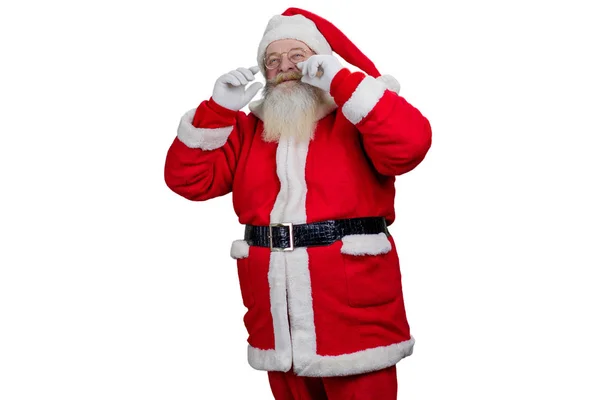 Święty Mikołaj dotyka swoich wąsów. — Zdjęcie stockowe