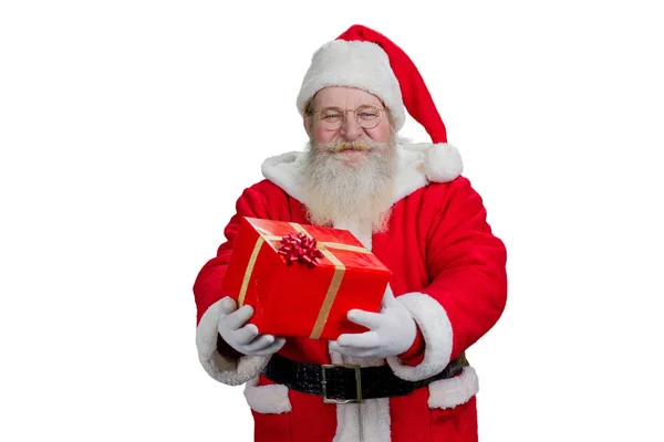 Santa Claus holding red box with present. — Stock Photo, Image