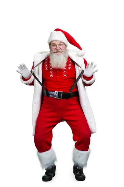 Lustiger Weihnachtsmann mit seinen Hosenträgern. — Stockfoto