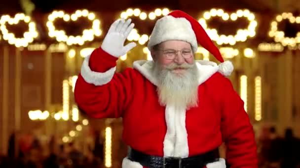 Santa claus macha ręką. — Wideo stockowe