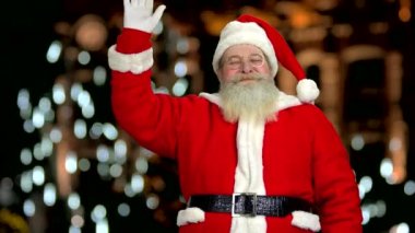 Mutlu Noel Baba sallanan el.