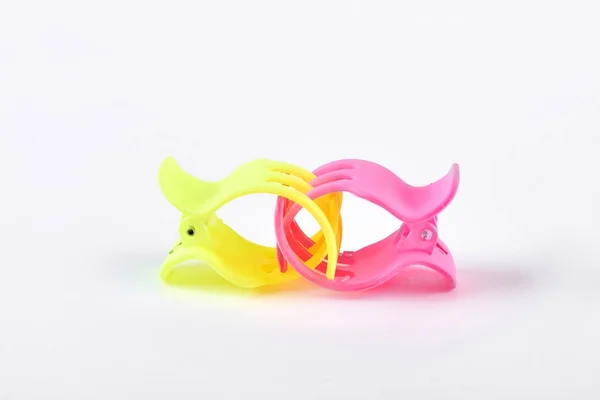Two colorful hair clips on white background.