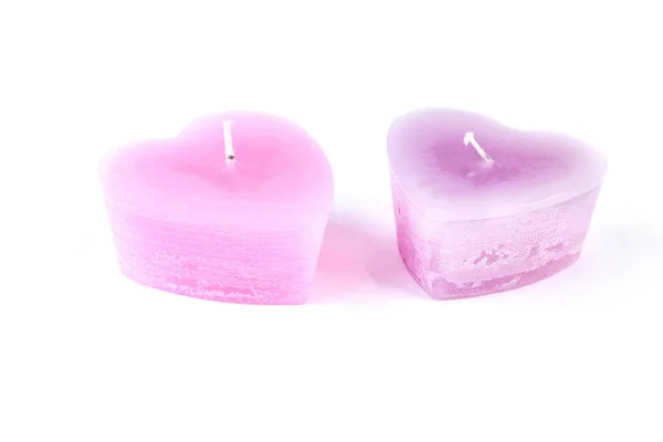 Velas de cera en forma de corazón rosa . —  Fotos de Stock