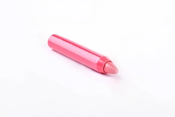 Розовый карандаш помады на белом фоне . — стоковое фото
