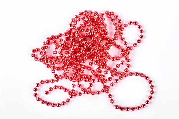 Red decoration beads on white background. — Stock Photo, Image