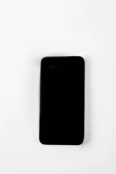 Czarny smartphone, widok z góry. — Zdjęcie stockowe